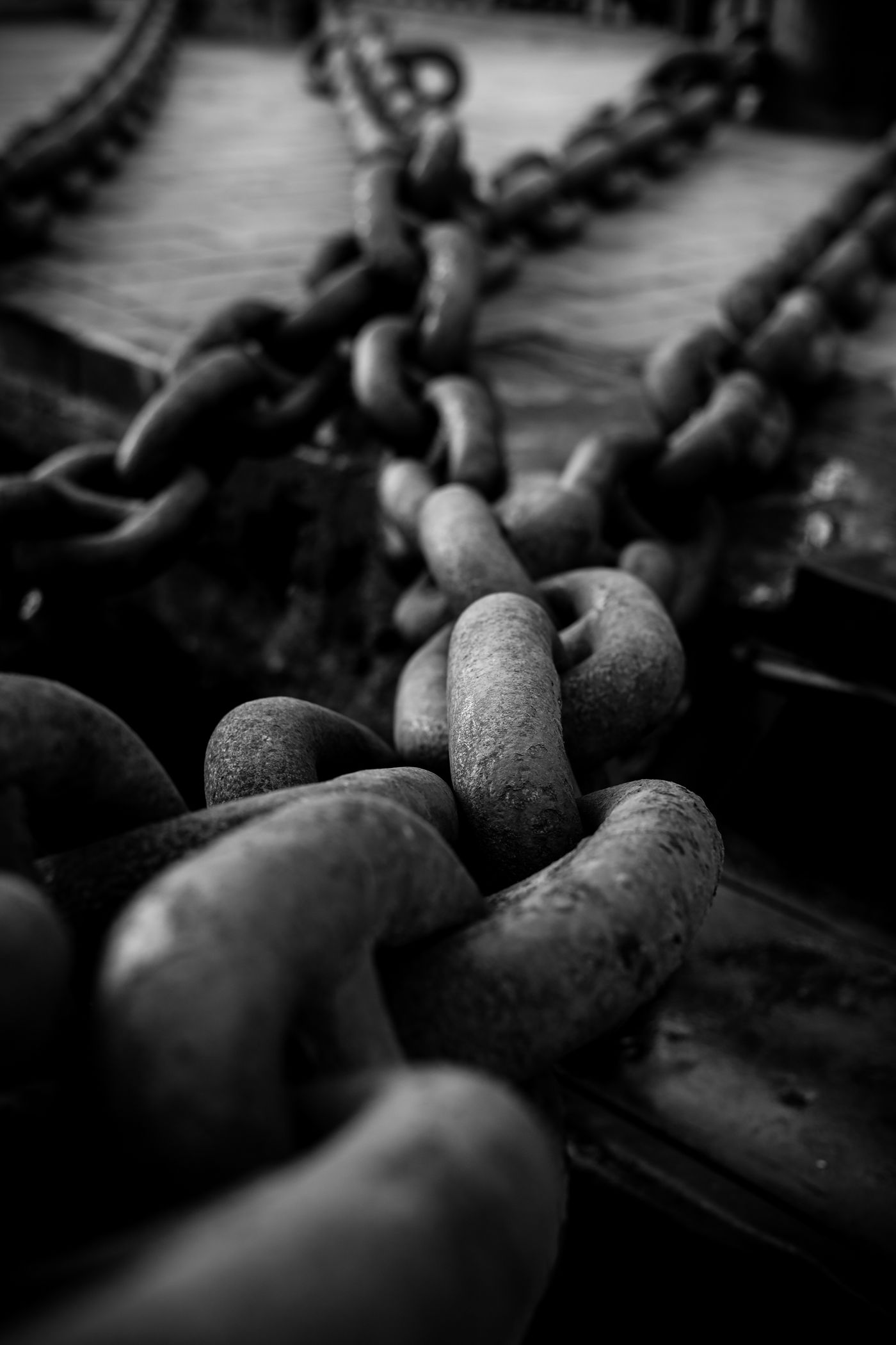 Heavy interlocking iron chains, a thematic image of coercion.